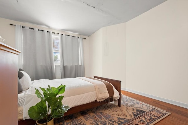 1314 College Point Blvd, College Point, NY 11356 - bedroom featuring baseboards and wood finished floors