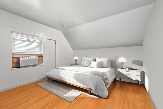 1314 College Point Blvd, College Point, NY 11356 - bedroom featuring cooling unit, lofted ceiling, and wood finished floors