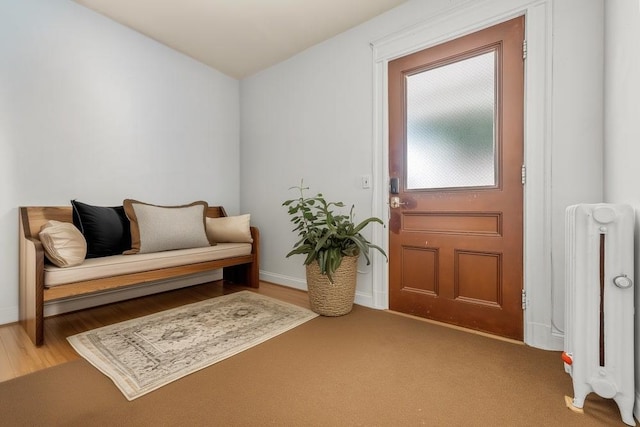 1314 College Point Blvd, College Point, NY 11356 - foyer with radiator heating unit and wood finished floors