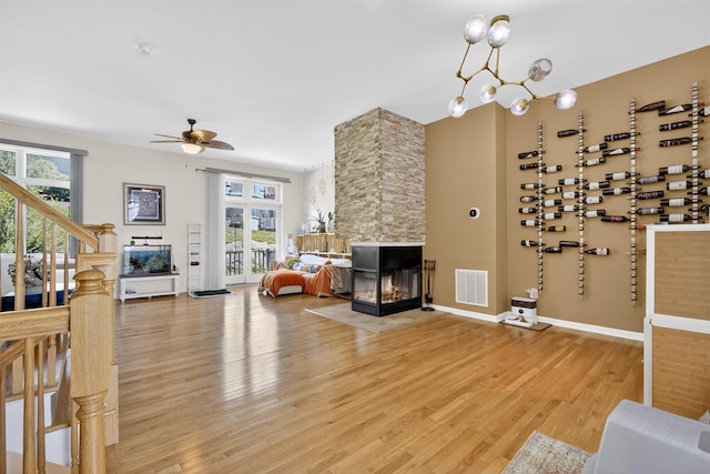 50 Corbin Hill Rd Unit 13, Fort Montgomery, NY 10922 - living area featuring light wood-style floors, a fireplace, and ceiling fan