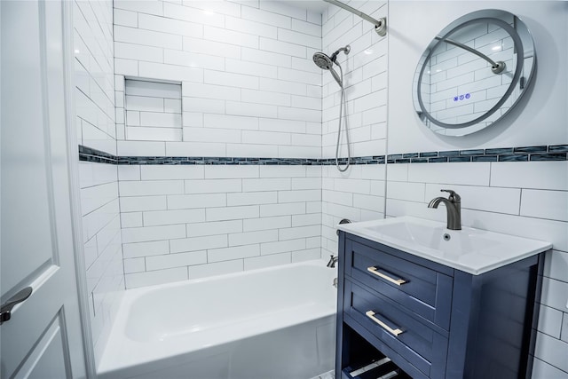460 Old Town Rd Unit 4-O, Port Jefferson Station, NY 11776 - bathroom featuring vanity, bathing tub / shower combination, and tile walls