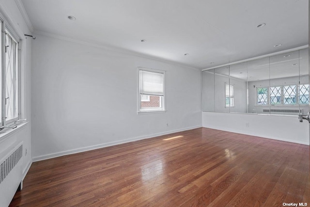 216 Raff Ave, Mineola, NY 11501 - unfurnished room featuring radiator heating unit, ornamental molding, wood finished floors, and recessed lighting