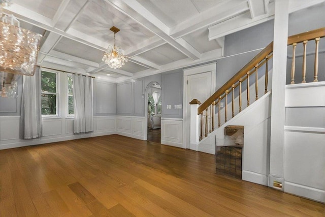 7 Wellesley Ave, Yonkers, NY 10705 - foyer featuring a decorative wall, wood finished floors, stairway, a chandelier, and coffered ceiling