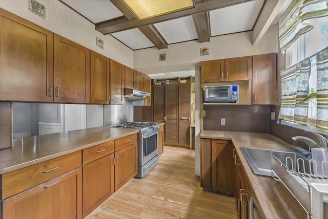 7 Wellesley Ave, Yonkers, NY 10705 - kitchen featuring stainless steel appliances, light wood-style flooring, plenty of natural light, under cabinet range hood, and beam ceiling