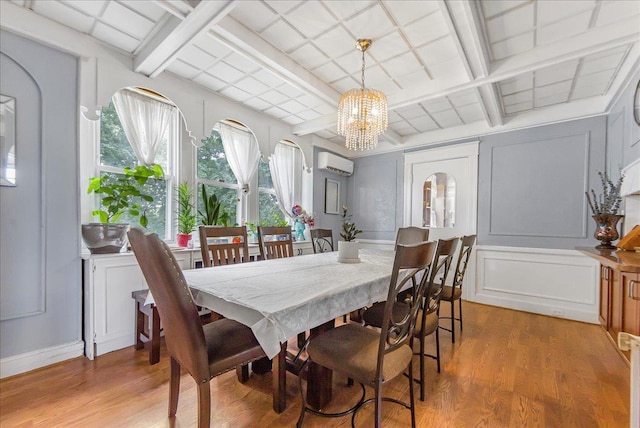 7 Wellesley Ave, Yonkers, NY 10705 - dining space featuring a wall mounted AC, light wood finished floors, a chandelier, coffered ceiling, and a decorative wall