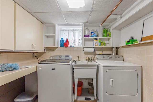 7 Wellesley Ave, Yonkers, NY 10705 - laundry room featuring cabinet space, separate washer and dryer, and tile walls