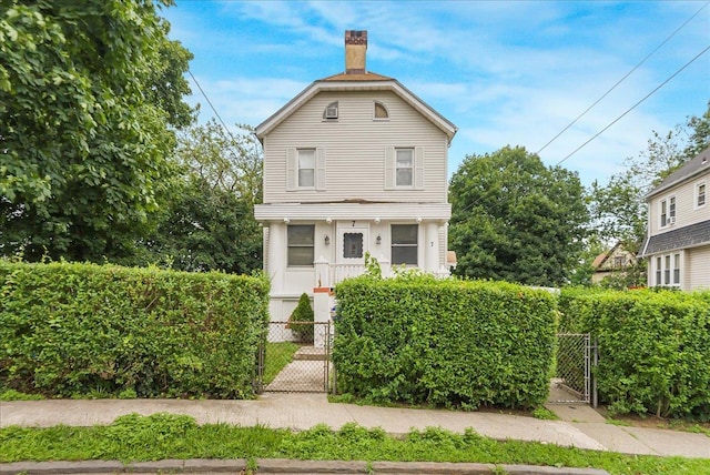7 Wellesley Ave, Yonkers, NY 10705 - view of front of home featuring a gate and a chimney