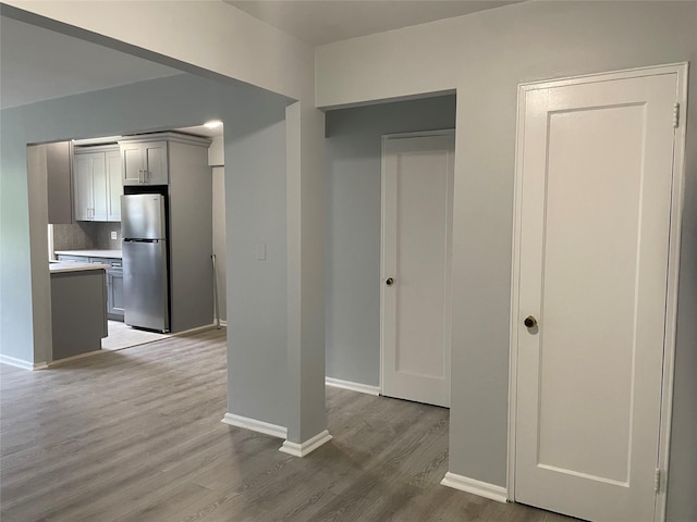 2 Fisher Dr Unit 307, Mount Vernon, NY 10552 - interior space featuring freestanding refrigerator, light countertops, wood finished floors, gray cabinets, and backsplash