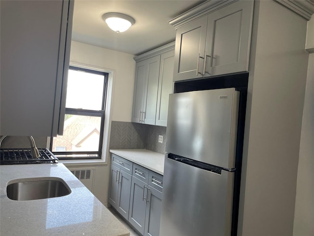 2 Fisher Dr Unit 307, Mount Vernon, NY 10552 - kitchen featuring freestanding refrigerator, gray cabinetry, backsplash, and light stone counters