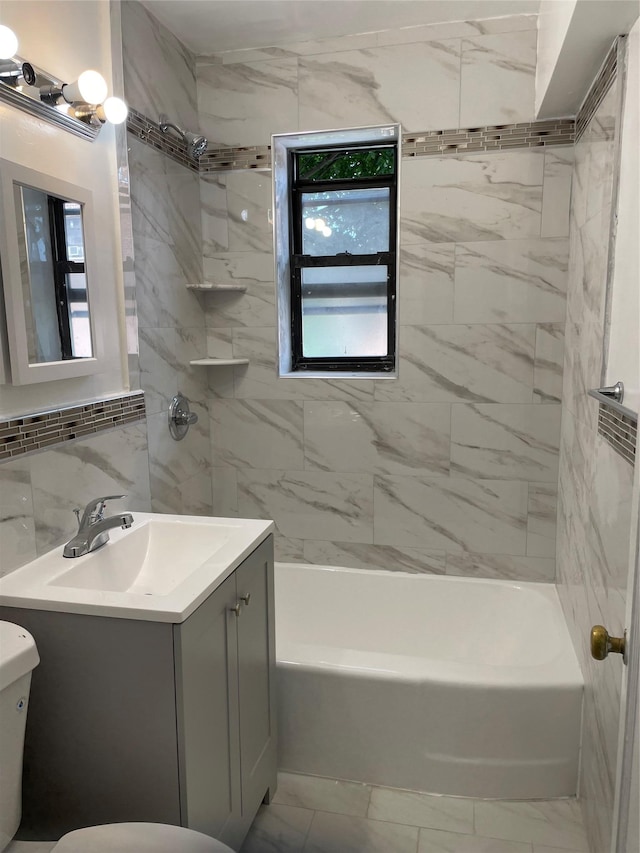 2 Fisher Dr Unit 307, Mount Vernon, NY 10552 - bathroom with vanity, marble look tiles, shower / tub combination, and tile walls