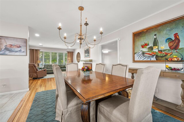1942 Lilac Dr, Westbury, NY 11590 - dining room with a chandelier, light wood-type flooring, ornamental molding, and recessed lighting