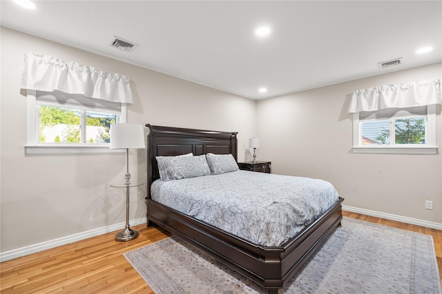 1942 Lilac Dr, Westbury, NY 11590 - bedroom featuring recessed lighting and wood finished floors