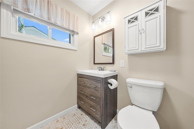 1942 Lilac Dr, Westbury, NY 11590 - half bathroom with vanity and tile patterned floors