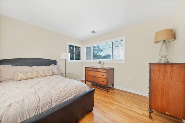 1942 Lilac Dr, Westbury, NY 11590 - bedroom featuring baseboards and light wood finished floors
