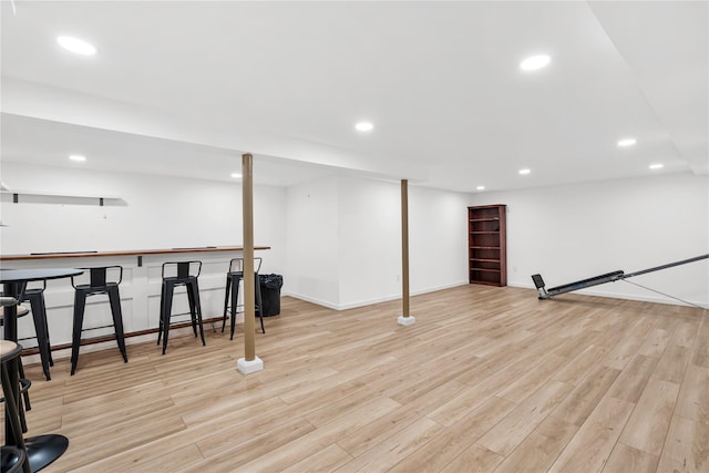 1942 Lilac Dr, Westbury, NY 11590 - finished basement featuring recessed lighting, wood finished floors, and bar