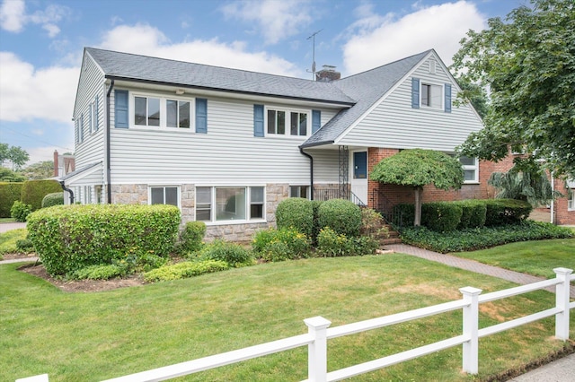 1901 New Hyde Park Rd, New Hyde Park, NY 11040 - tri-level home with stone siding and a chimney