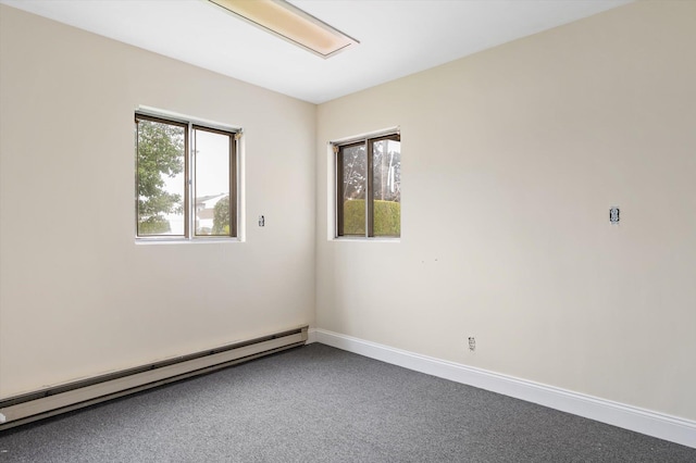 1901 New Hyde Park Rd, New Hyde Park, NY 11040 - carpeted spare room with baseboard heating and baseboards