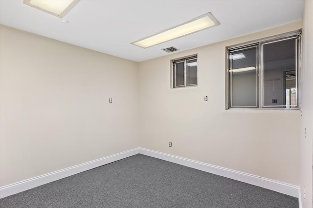 1901 New Hyde Park Rd, New Hyde Park, NY 11040 - unfurnished room featuring baseboards and dark colored carpet