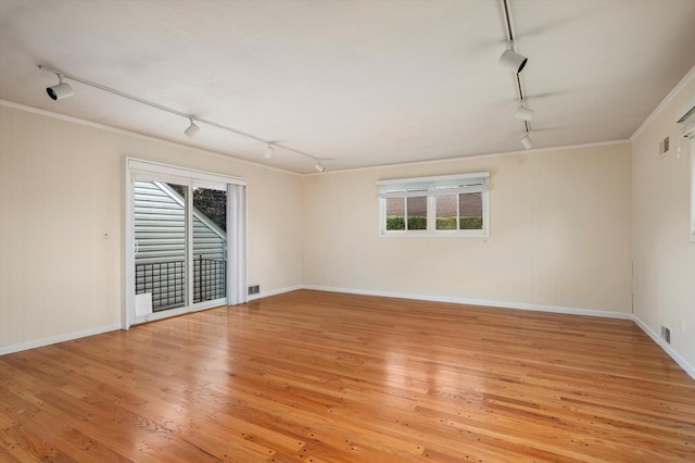 1901 New Hyde Park Rd, New Hyde Park, NY 11040 - spare room featuring track lighting, light wood-type flooring, and ornamental molding