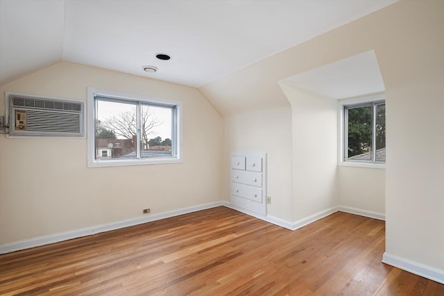 1901 New Hyde Park Rd, New Hyde Park, NY 11040 - bonus room with lofted ceiling, healthy amount of natural light, light wood-type flooring, and a wall mounted AC