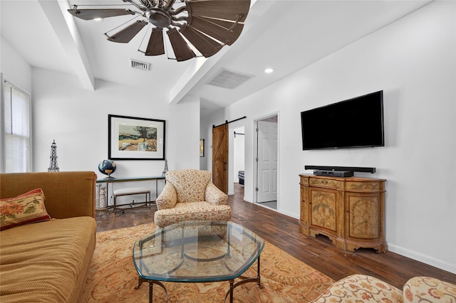 16 Broadway, Loch Sheldrake, NY 12759 - living area with a barn door, wood finished floors, beam ceiling, ceiling fan, and recessed lighting