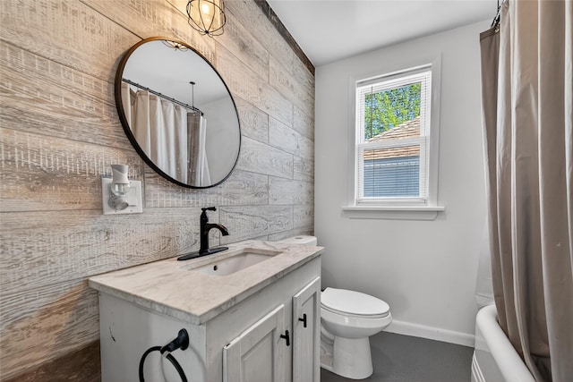 16 Broadway, Loch Sheldrake, NY 12759 - full bathroom featuring wooden walls, vanity, shower / tub combo, and an accent wall