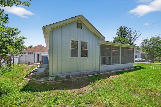 16 Broadway, Loch Sheldrake, NY 12759 - view of side of property featuring a sunroom and a yard
