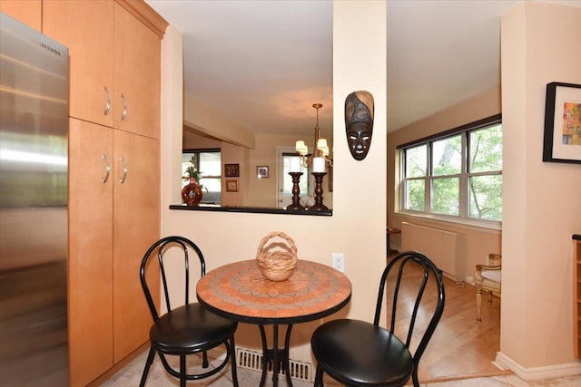 180 S Middle Neck Rd Unit 1-Q, Great Neck, NY 11021 - dining space with radiator heating unit and wood finished floors