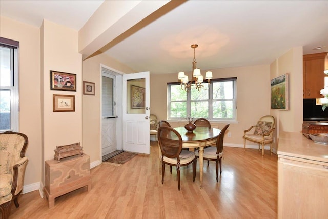 180 S Middle Neck Rd Unit 1-Q, Great Neck, NY 11021 - dining space with a chandelier and light wood-style flooring