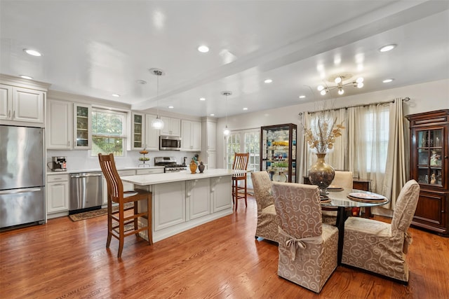 194 Valentine St, Yonkers, NY 10704 - dining area featuring recessed lighting, wood finished floors, and a chandelier
