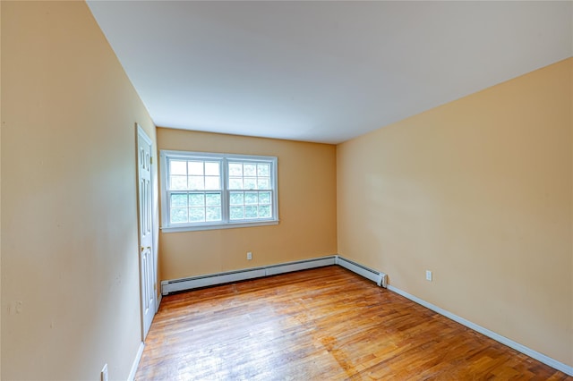 10 Valentine Rd, Shoreham, NY 11786 - empty room with light wood finished floors and baseboard heating
