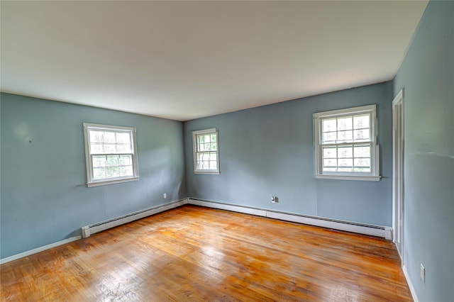 10 Valentine Rd, Shoreham, NY 11786 - unfurnished room with wood finished floors and a baseboard radiator