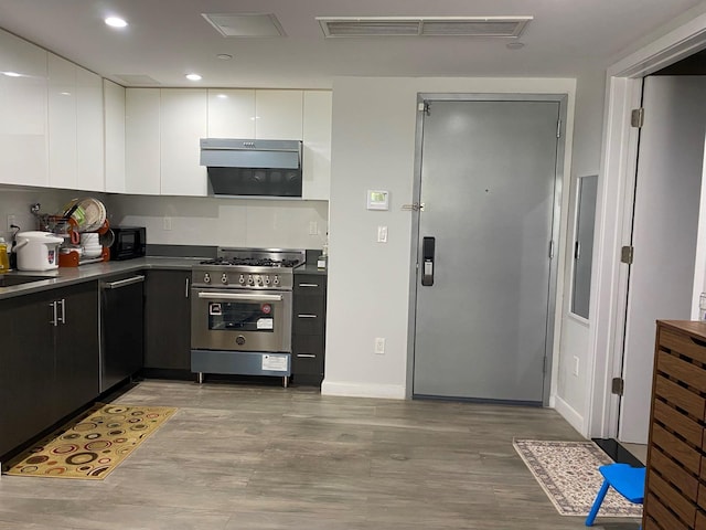 158-15 Union Tpke Unit 2D, Fresh Meadows, NY 11366 - kitchen with high end stove, dishwashing machine, white cabinets, black microwave, and light wood-style flooring