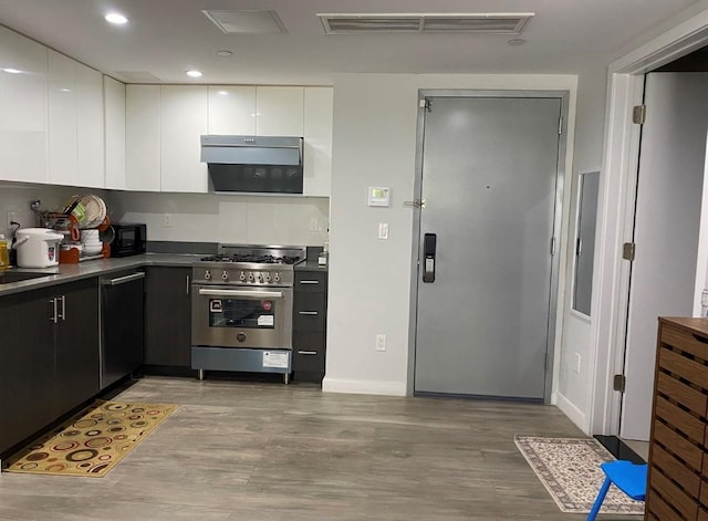 158-15 Union Tpke Unit 2D, Fresh Meadows, NY 11366 - kitchen with high end stove, dishwashing machine, white cabinets, modern cabinets, and light wood-type flooring