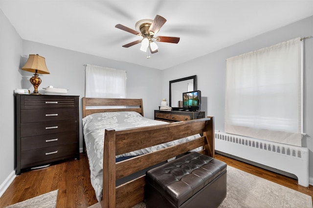 15 Cedar Ln, Cornwall, NY 12518 - bedroom featuring radiator, wood finished floors, and a ceiling fan