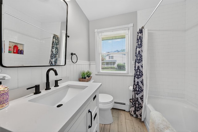15 Cedar Ln, Cornwall, NY 12518 - full bathroom with baseboard heating, wood finished floors, vanity, wainscoting, and shower / tub combo with curtain