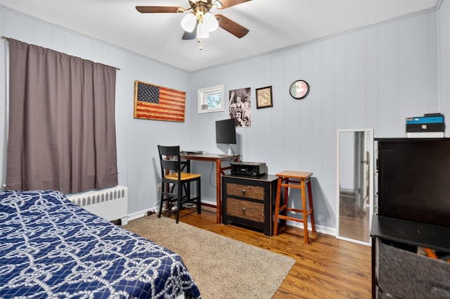15 Cedar Ln, Cornwall, NY 12518 - bedroom featuring radiator, ornamental molding, wood finished floors, and a ceiling fan