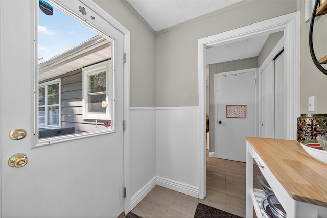 15 Cedar Ln, Cornwall, NY 12518 - doorway featuring light tile patterned floors and crown molding