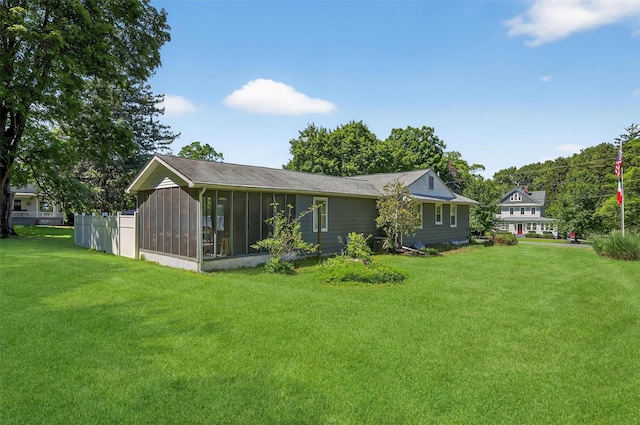 15 Cedar Ln, Cornwall, NY 12518 - rear view of house with a sunroom and a lawn