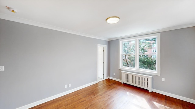 1133 Midland Ave Unit 3J, Bronxville, NY 10708 - unfurnished room featuring radiator, ornamental molding, wood finished floors, and a smoke detector