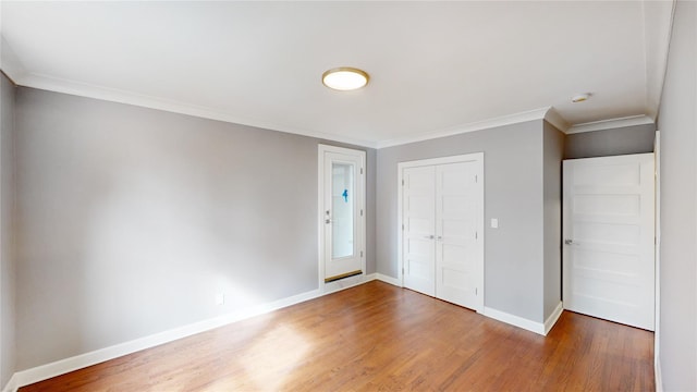 1133 Midland Ave Unit 3J, Bronxville, NY 10708 - unfurnished bedroom with wood finished floors, a closet, and crown molding