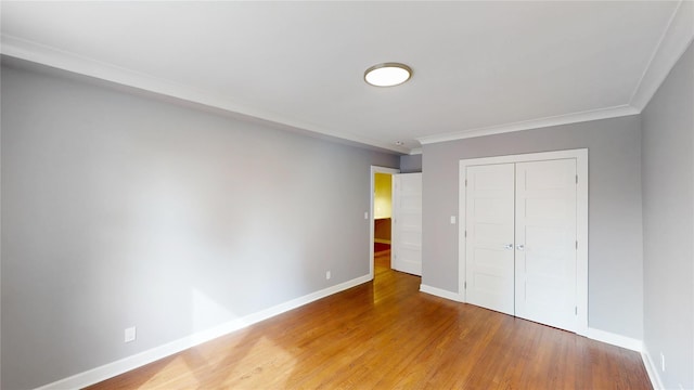 1133 Midland Ave Unit 3J, Bronxville, NY 10708 - unfurnished bedroom with a closet, wood finished floors, and crown molding