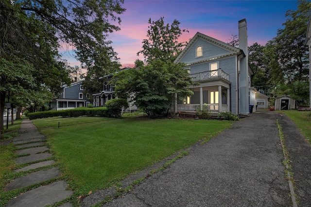 13 Garfield Pl, Poughkeepsie, NY 12601 - neoclassical / greek revival house featuring a balcony, a chimney, a lawn, and a shed