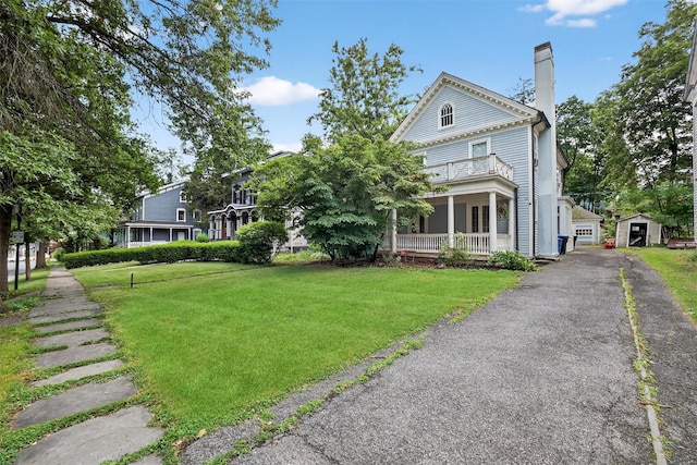 13 Garfield Pl, Poughkeepsie, NY 12601 - greek revival inspired property featuring a front yard, an outbuilding, a chimney, and a balcony