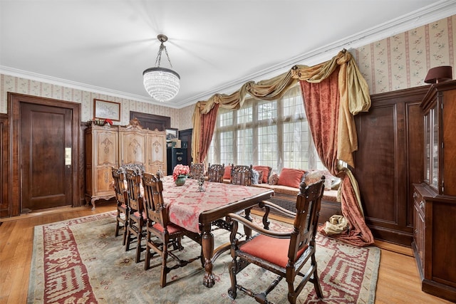 13 Garfield Pl, Poughkeepsie, NY 12601 - dining area with wallpapered walls, ornamental molding, and light wood finished floors