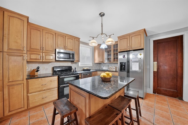 13 Garfield Pl, Poughkeepsie, NY 12601 - kitchen with stainless steel appliances, light tile patterned floors, decorative backsplash, and glass insert cabinets