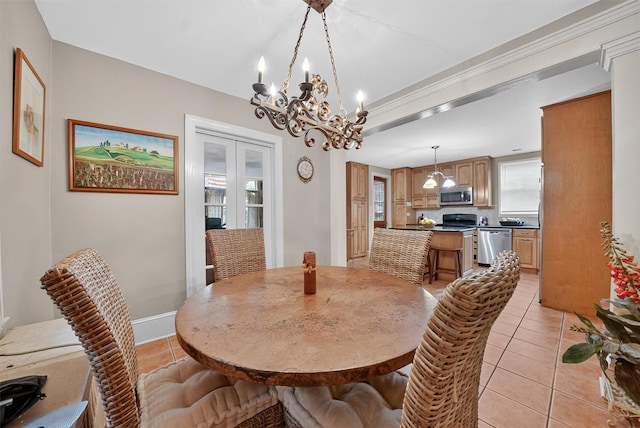 13 Garfield Pl, Poughkeepsie, NY 12601 - dining room featuring a chandelier, light tile patterned flooring, and french doors
