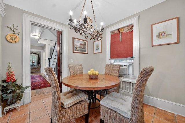 13 Garfield Pl, Poughkeepsie, NY 12601 - dining space featuring light tile patterned floors, a chandelier, and cooling unit