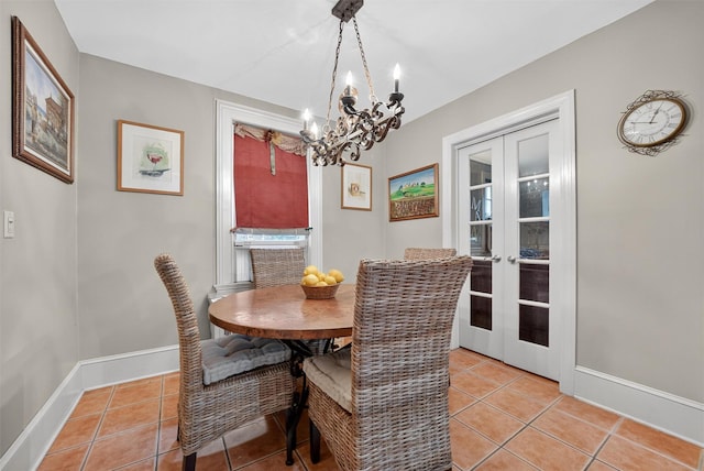 13 Garfield Pl, Poughkeepsie, NY 12601 - dining area with french doors, light tile patterned flooring, and a chandelier