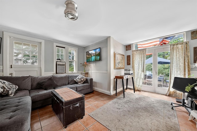 13 Garfield Pl, Poughkeepsie, NY 12601 - living area with light tile patterned floors, plenty of natural light, and a wainscoted wall